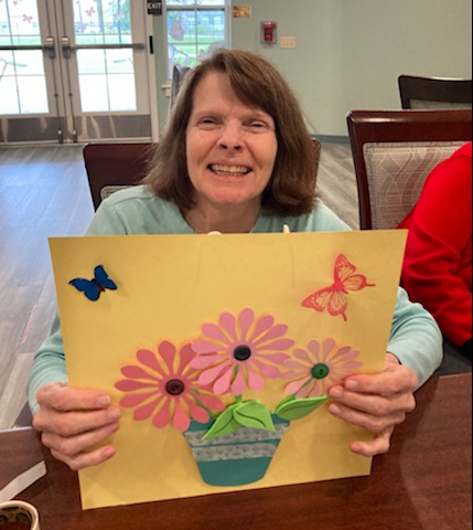 Three happy women hugging.