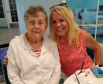 senior and child smiling at table